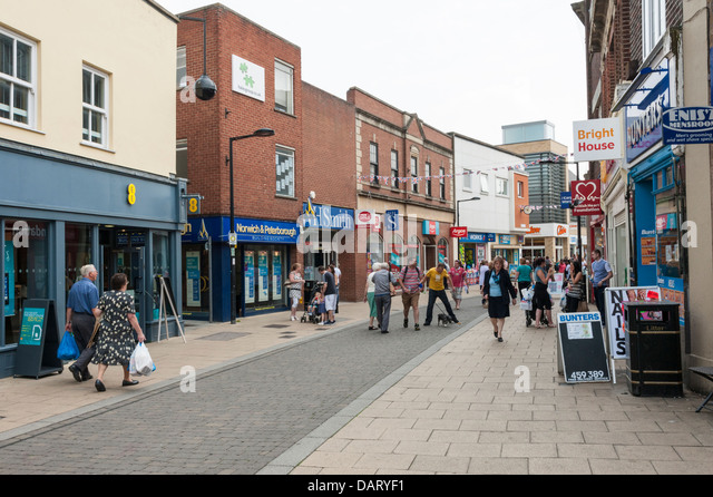 Shoppers and shops at the High Street Huntingdon Cambridgeshire UK ...